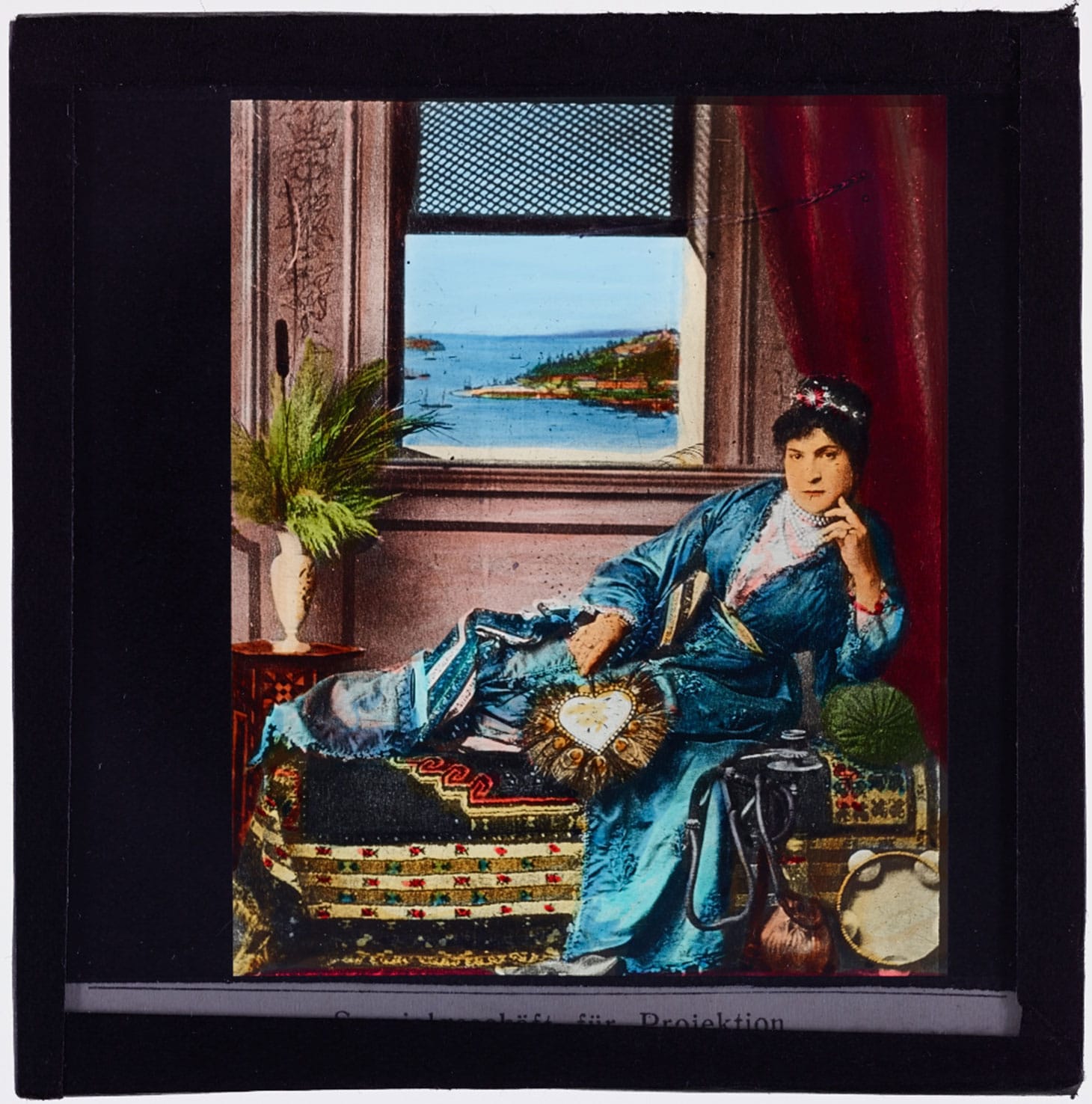 Woman reclining on couch (1900), glass lantern slide
