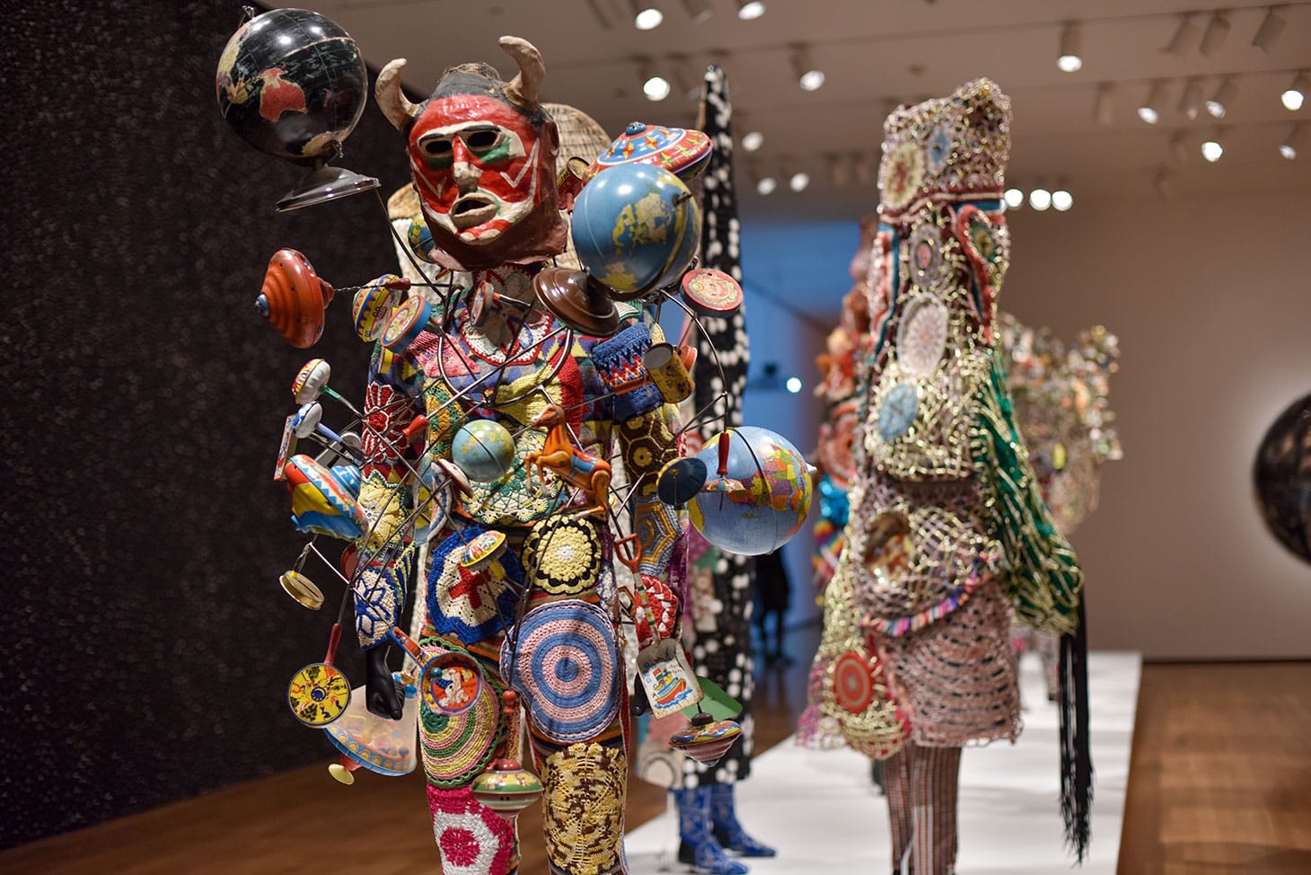 Installation view of <em/>FEAT. at the Akron Art Museum with Soundsuit(2016) at forefront (photo courtesy of Akron Art Museum)