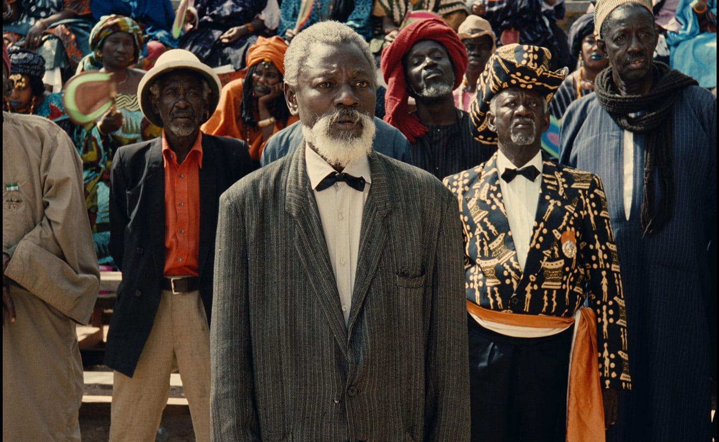 Mansour Diouf (center, as Dramaan) in <em/>Hyenas, a film by Djibril Diop Mambéty, a Metrograph Pictures release