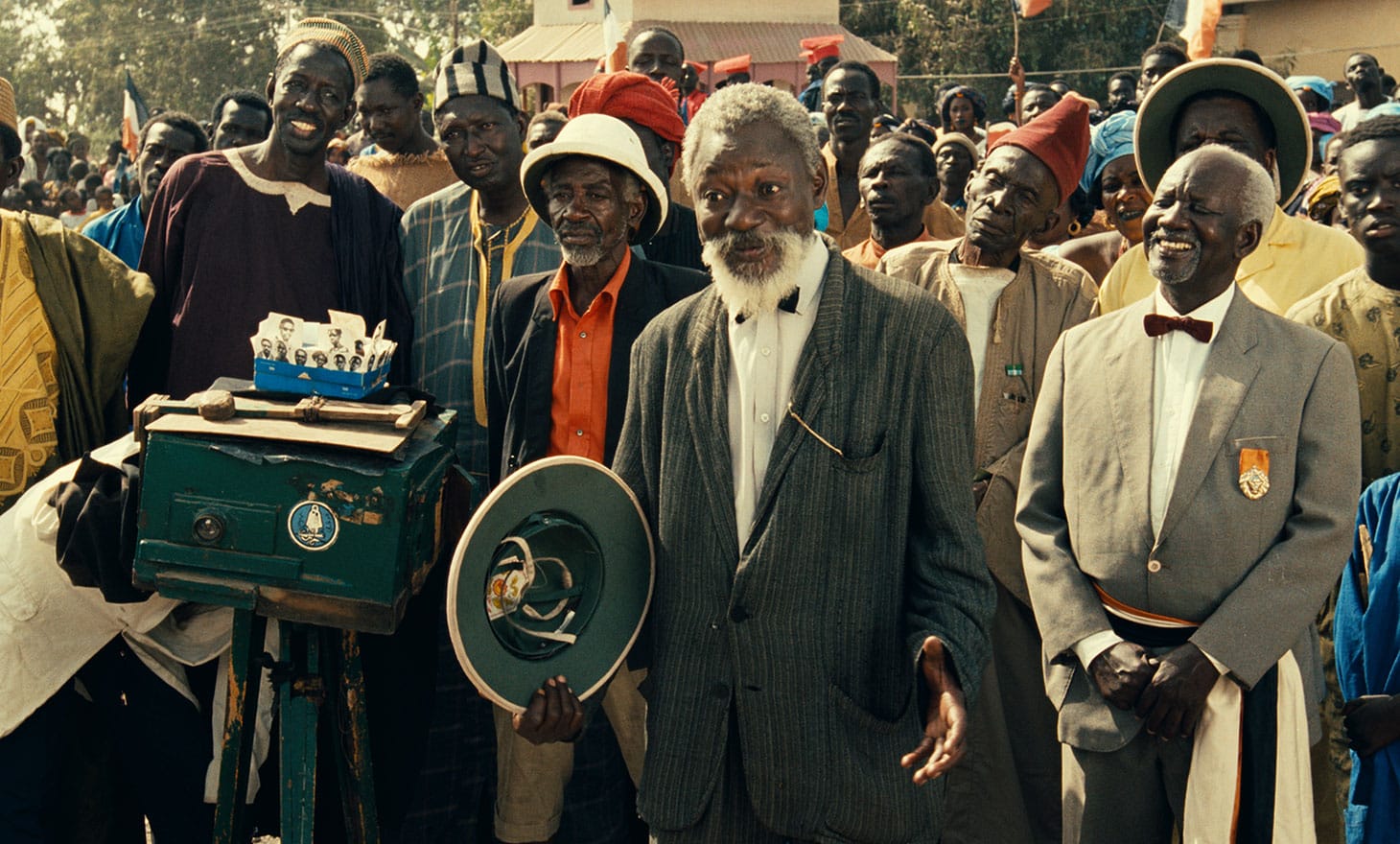Mansour Diouf (center, as Dramaan) in <em/>Hyenas, a film by Djibril Diop Mambéty, a Metrograph Pictures release
