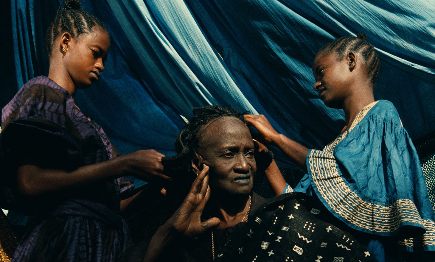Ami Diakhate (center, as Linguere Ramatou) in <em/>Hyenas, a film by Djibril Diop Mambéty, a Metrograph Pictures release
