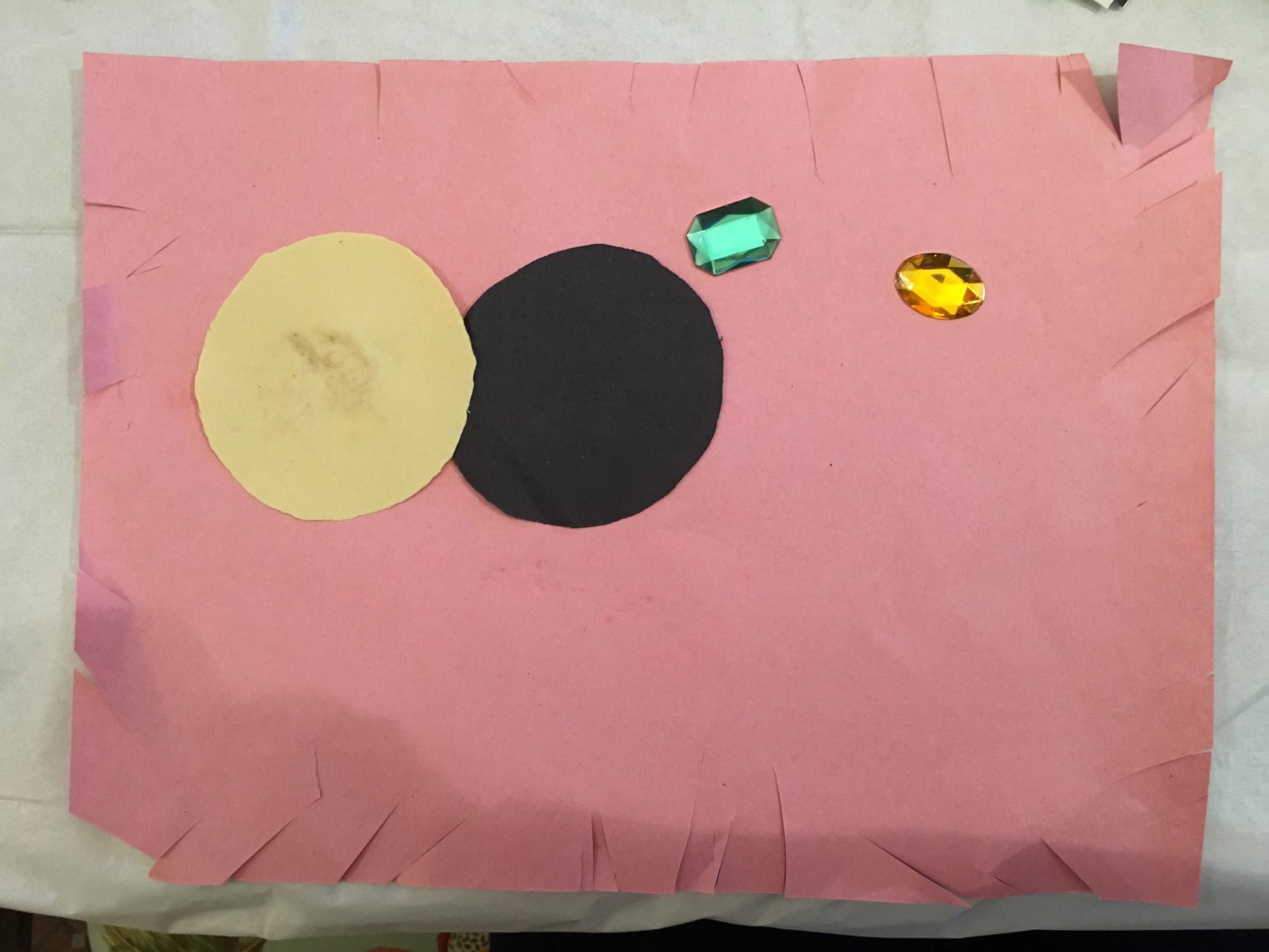 Jude E, "Circle Jewel" (2019), construction paper, jewels (all photos by the author for Hyperallergic)