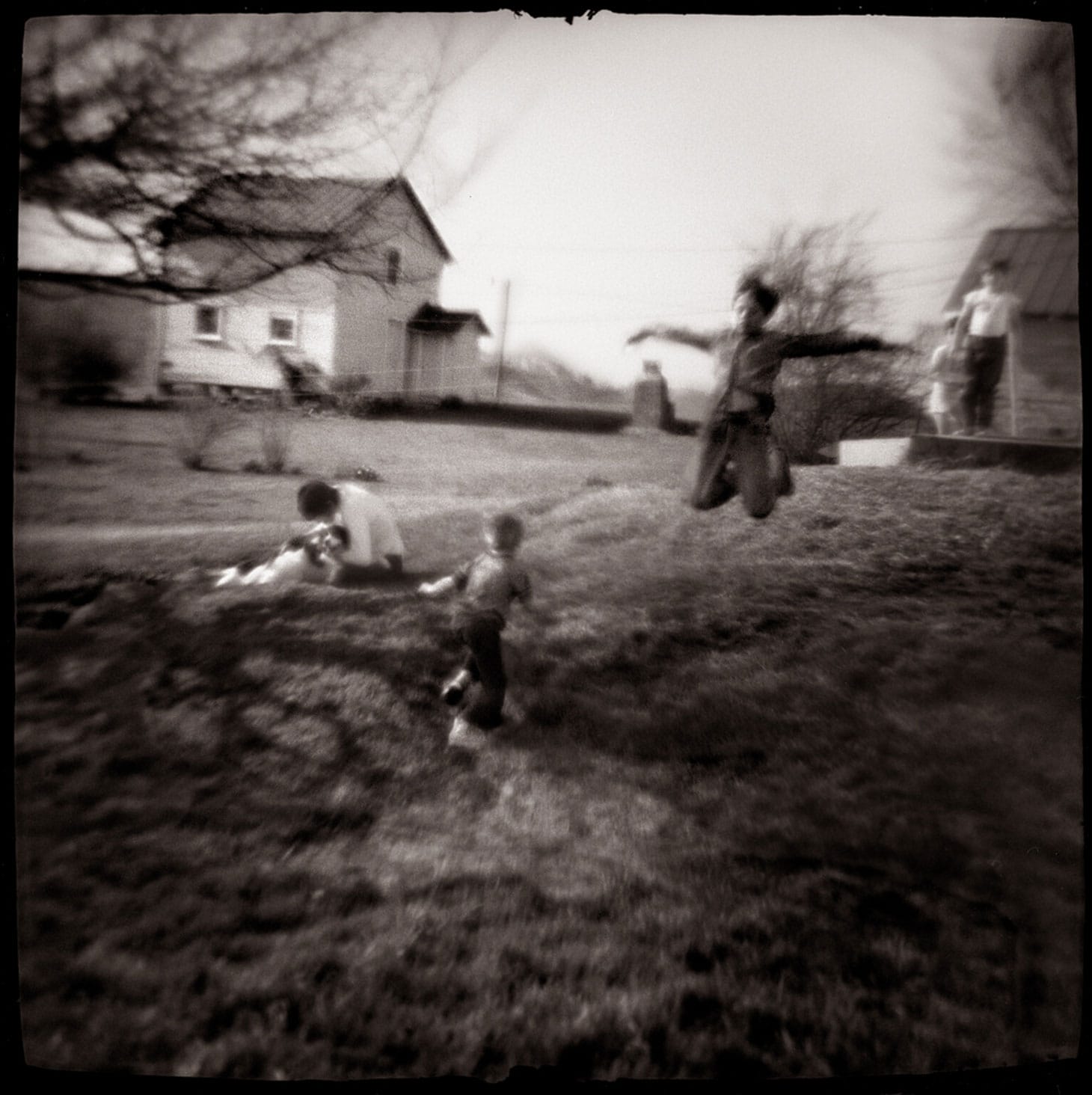 Nancy Rexroth, "Boys Flying, Amesville, Ohio" 1976), gelatin silver print (© The 1988 Rexroth Family Trust)