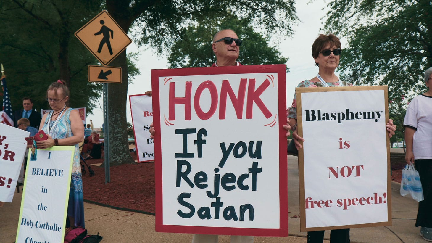 Protest sign against The Satanic Temple in Little Rock, AR from <em/>Hail Satan, a Magnolia Pictures release