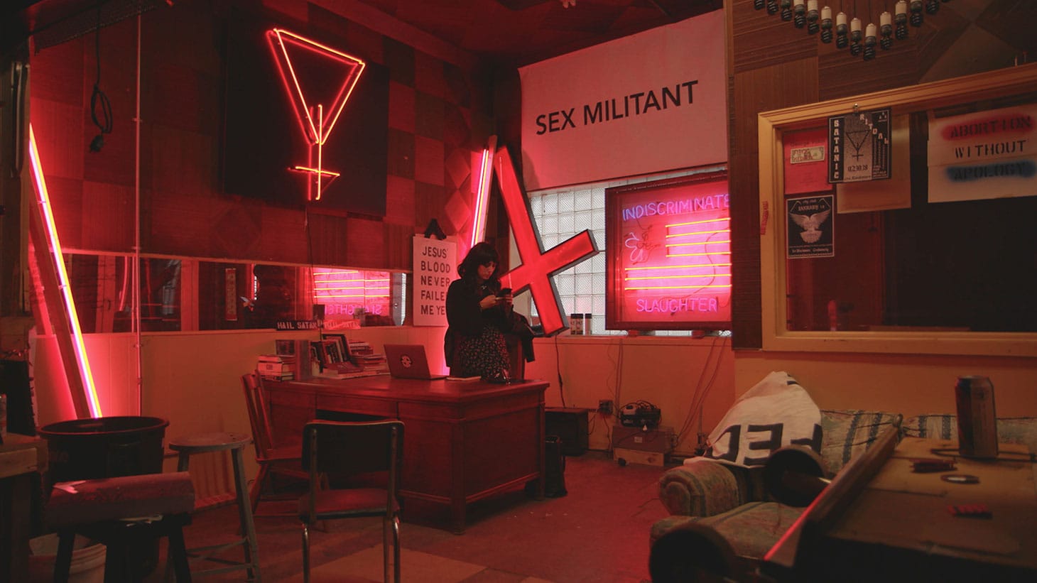 Jex Blackmore in her office in Detroit in <em/>Hail Satan?, a Magnolia Pictures release