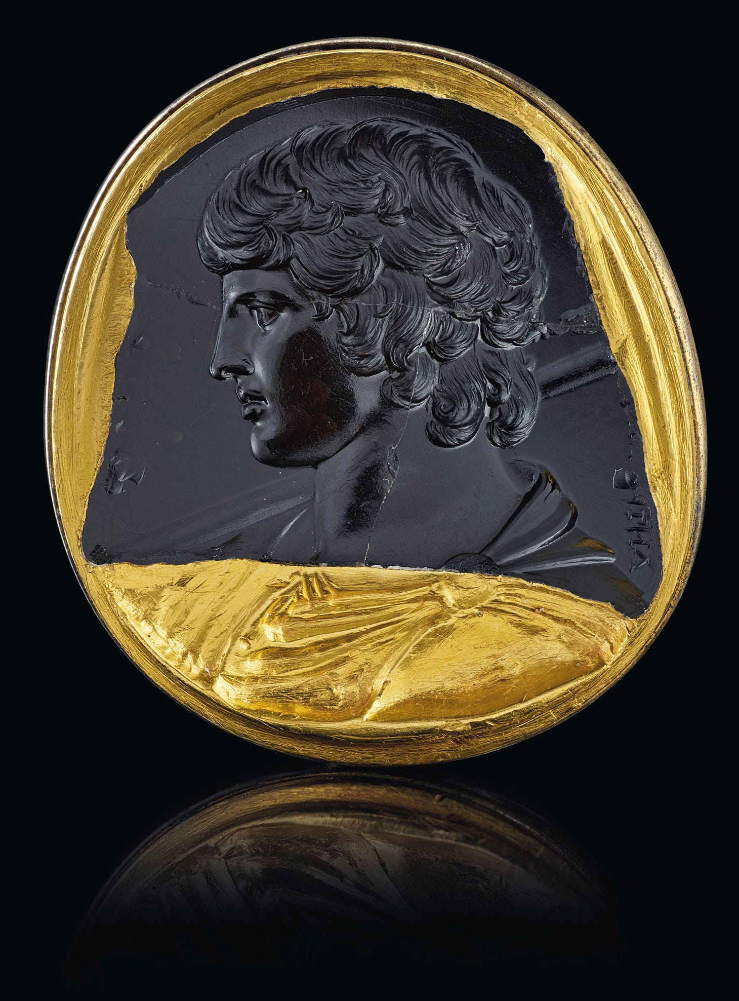A Roman black chalcedony intaglio portrait of Antinous (c. mid-2nd century CE), in a Renaissance gold mount, 1 3/8 inches long (image courtesy Christie's)