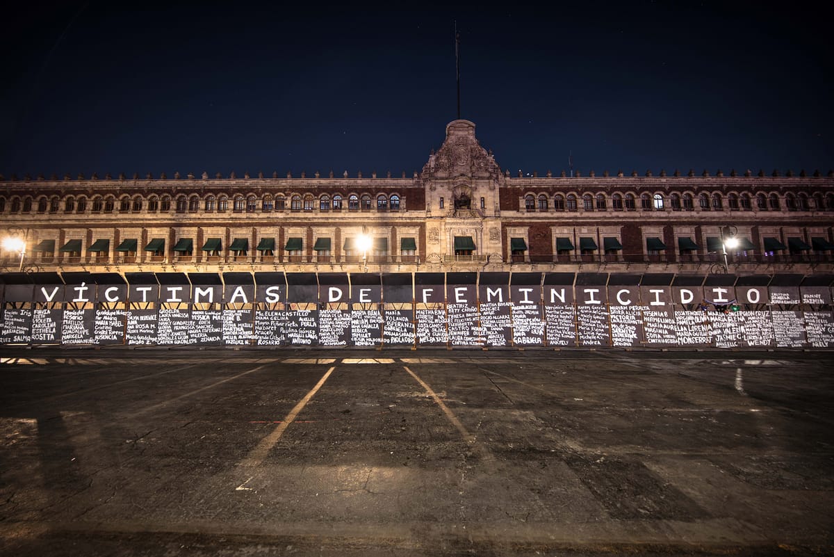 Activists Paint Names of Femicide Victims Outside of Mexico’s Presidential Palace