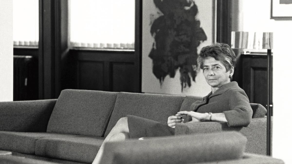 Black-and-white photograph of Esther Gottlieb sitting on a couch.
