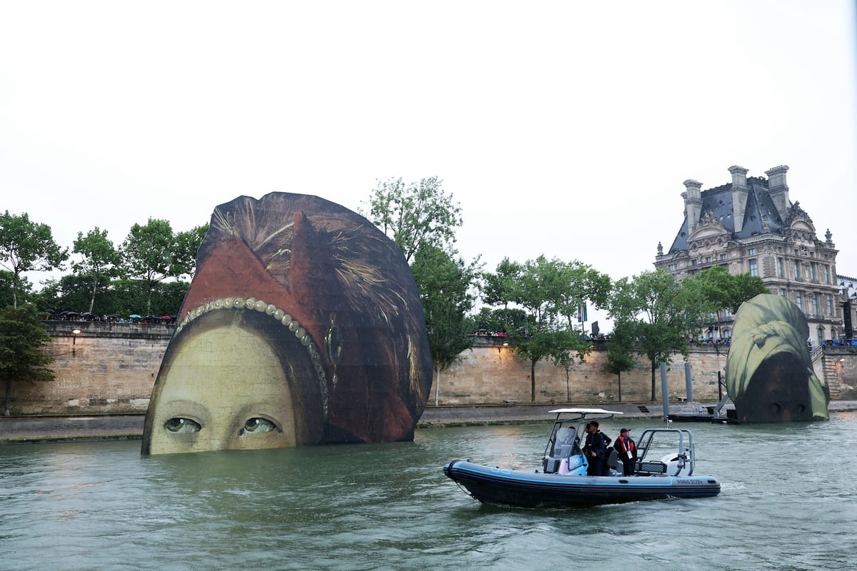 What Are Those Giant Painted Heads Floating in the Seine?