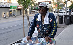 A Ladder, a Gate, and a Paintbrush: The Picasso of Harlem Returns to 125th Street