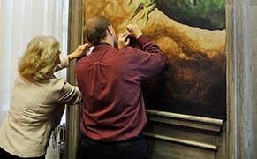 Politician Stupidly Leans on Thomas Hart Benton Mural to Take Notes