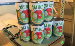 Display of Canned Parrot Meat Ruffles Feathers in San Francisco