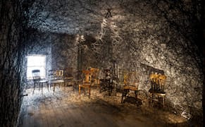 A Three-Story Web Ensnares an Abandoned Building's Past Lives