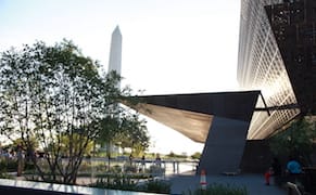 The main entrance to the National Museum of African American History and Culture in Washington, DC with the Washington Monume