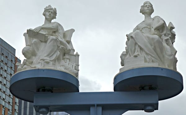 Gilded Age Statues Return to the Manhattan Bridge, Now with Kinetic Illumination