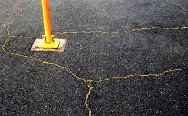 An Artist Mends Cracks in the Sidewalk with Gold