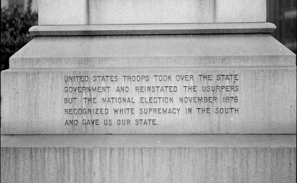 Dorothea Lange, "One side of the monument erected to race prejudice. New Orleans, Louisiana" (1936) (via Wikimedia Commons)