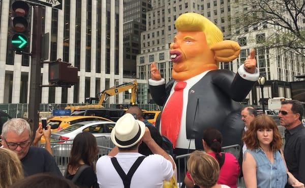 Thousands of Protesters and an Inflatable Rat Welcome President Trump Back to NYC