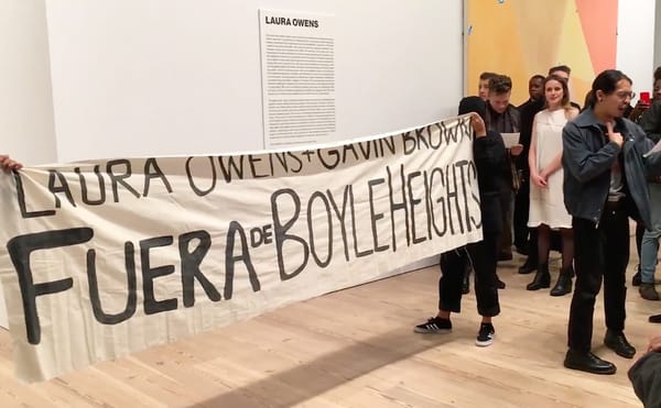 Members of Boyle Heights Alliance Against Artwashing and Displacement (BHAAAD) protest at the Whitney Museum during Laura Owe