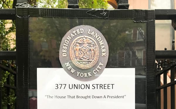 The satirical plaque at the entrance to Paul Manafort's Brooklyn brownstone