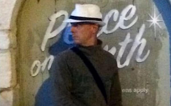 Tourist in Bethlehem Believes He Photographed Banksy Wearing Cargo Shorts