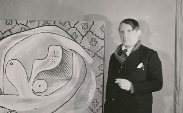 Anonymous, "Pablo Picasso in front of the oil on canvas “'Le Repos' at the Georges Petit Gallery" (1932), gelatin silver prin