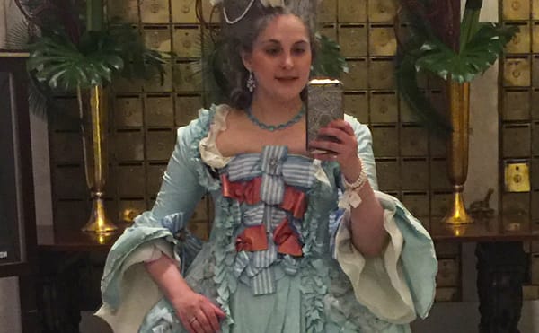 Eliza Vincz in the 18th-century style robe à la française that got her denied entry to the Metropolitan Museum. (photo courte