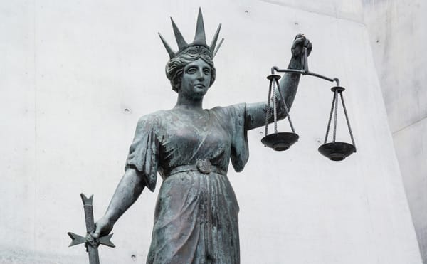 Statue of Themis, an ancient Greek personification of law and justice, in Brisbane (photo by Rae Allen/Flickr)