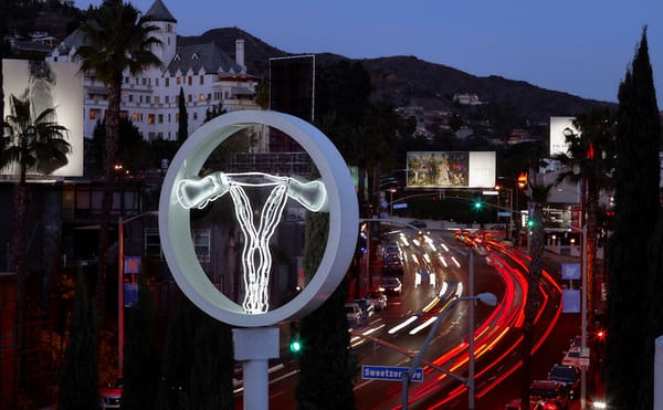 A Bright Neon Uterus Fights for Attention on the Sunset Strip