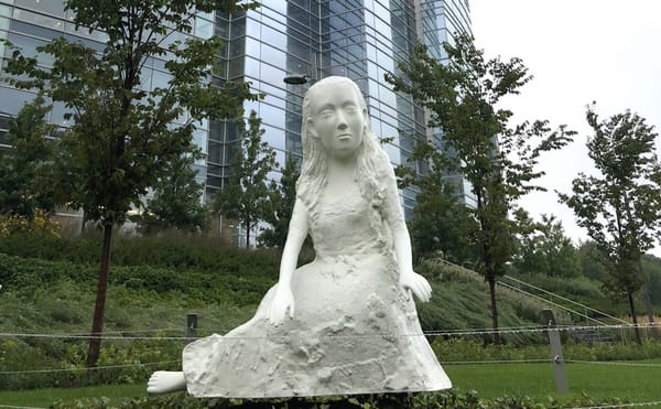 Kiki Smith Makes a Subversive Sculpture of Alice in Wonderland at the Foot of a Skyscraper
