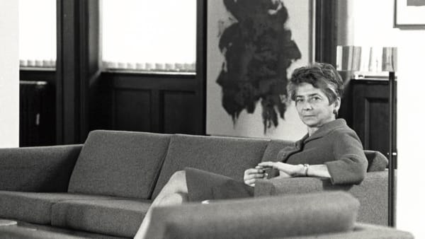 Black-and-white photograph of Esther Gottlieb sitting on a couch.