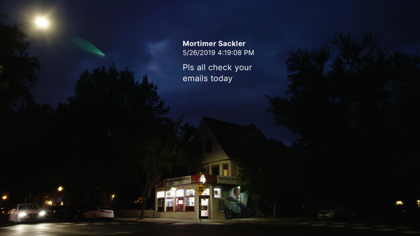 A film still of a corner deli in a suburban neighborhood on an empty street, taken at night. Mortimer Sackler's text "Pls che