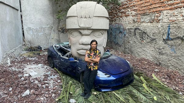 Artist Crushes Tesla With Colossal Olmec Head Sculpture