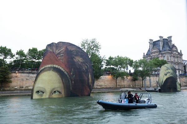 What Are Those Giant Painted Heads Floating in the Seine?